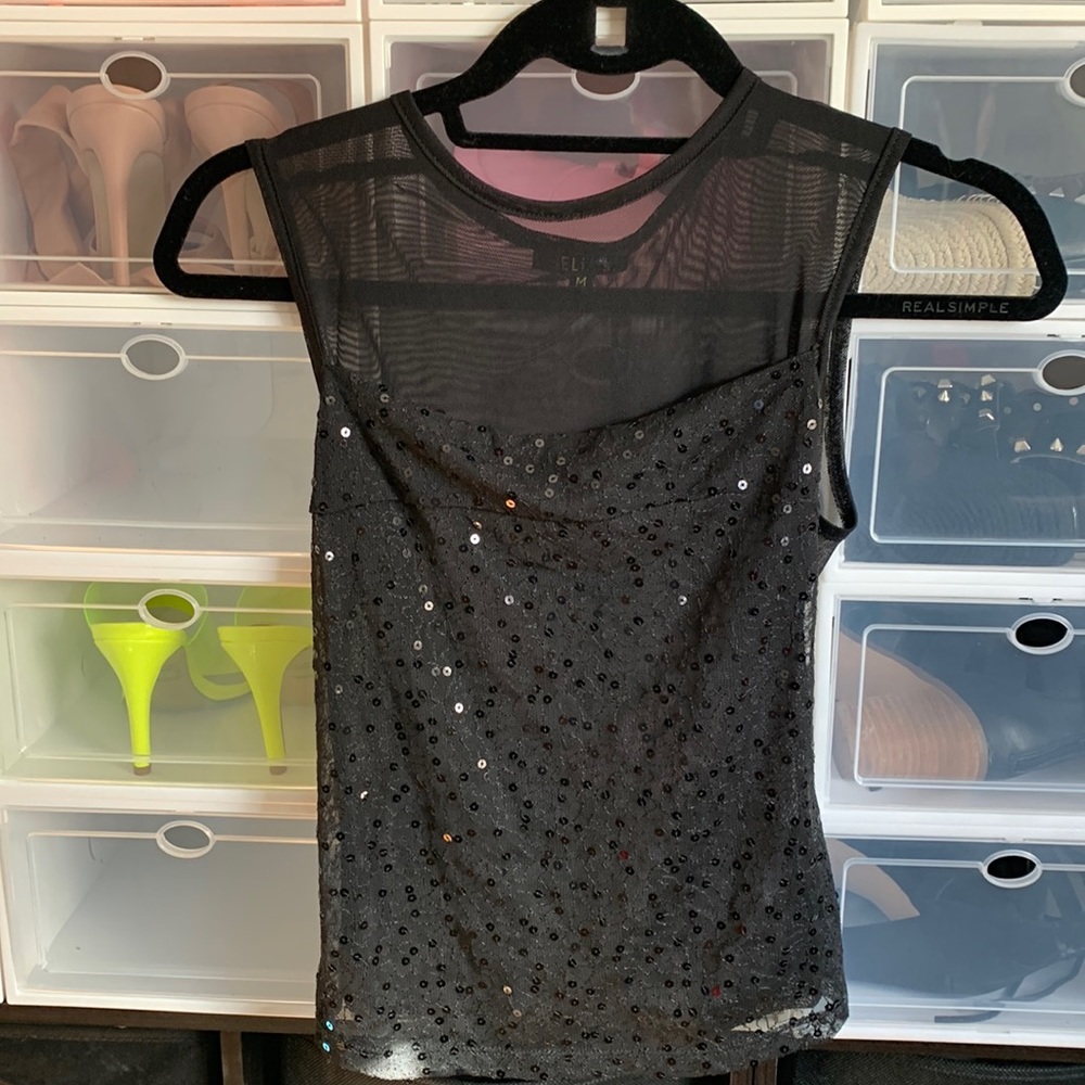 Delia’s Sparkle and see through top. New with tags.